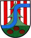 Herb Niska przedstawia na tarczy dwudzielnej z lewa w skos złotym pasem w polu górnym sześć słupów srebrnych i pięć czerwonych na przemian, na których umieszczono złotą koronę, natomiast w polu dolnym błękitnym złotą jodłę.